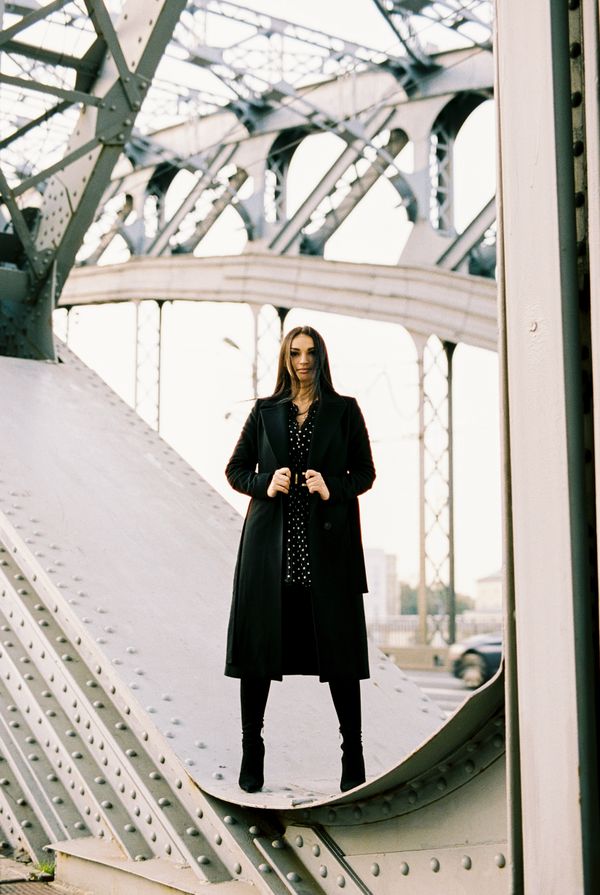 A woman in a long coat